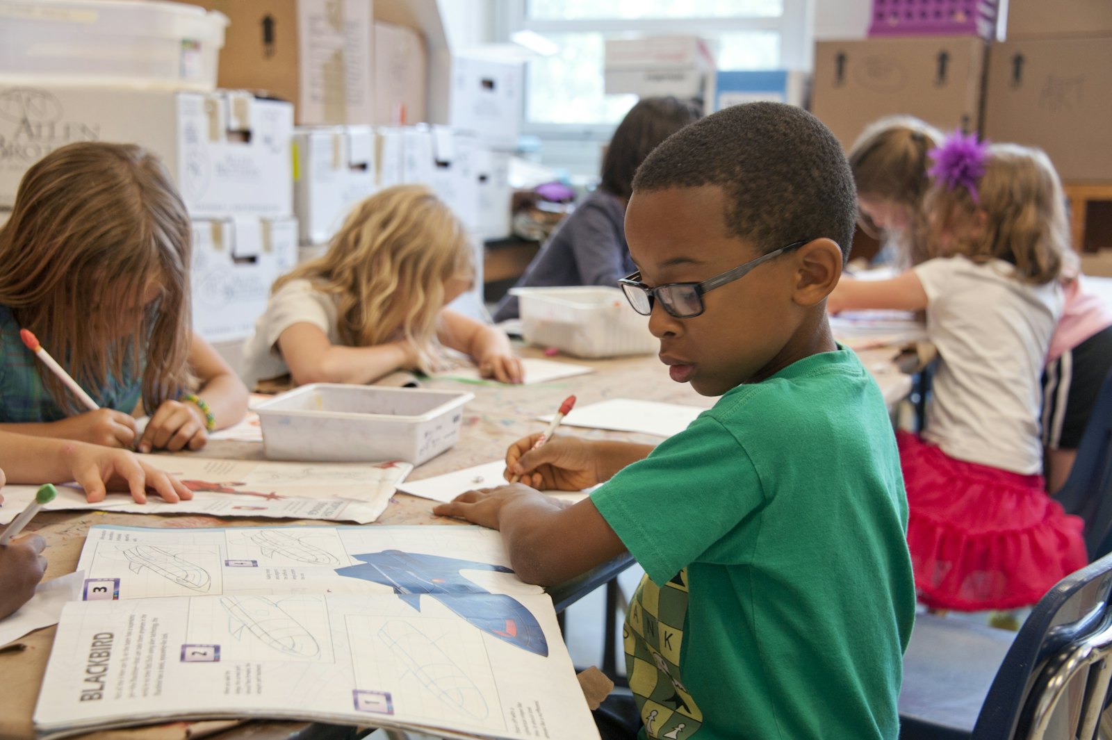 Young students working together in class